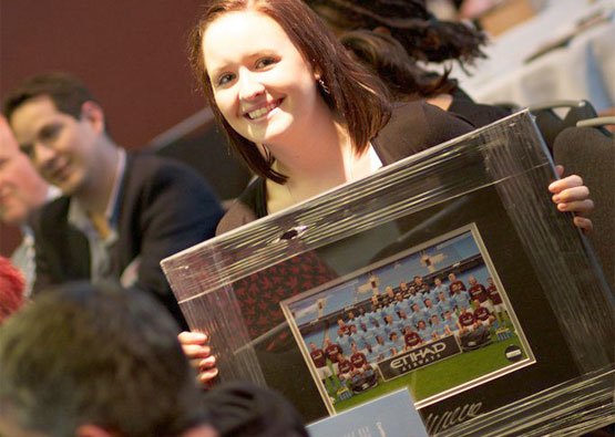 Suzi holding MCFC squad photo