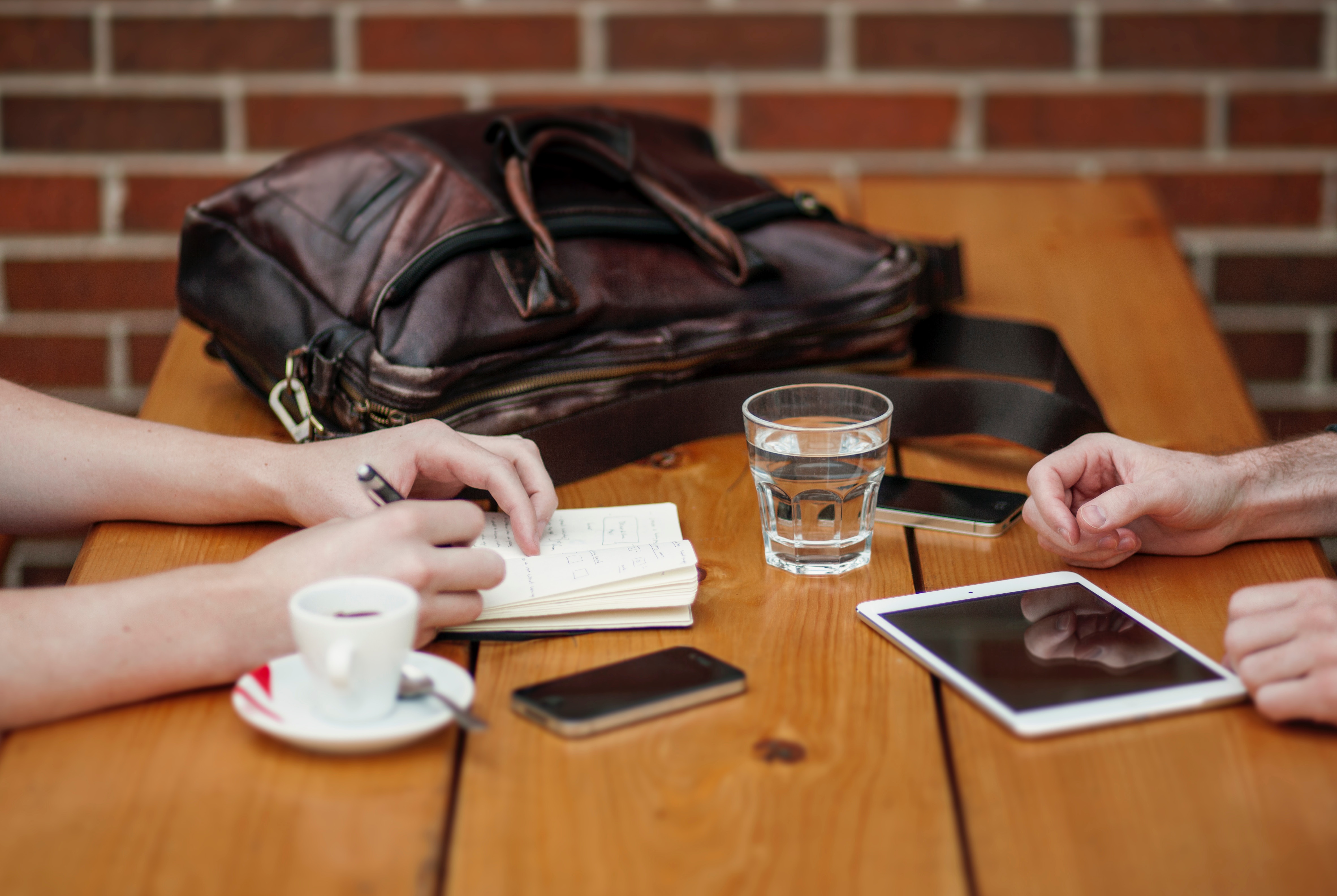 Talking at a table and making notes