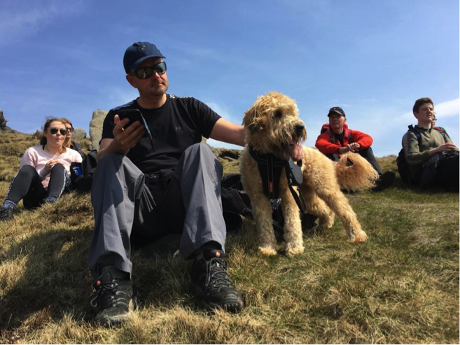 Simon Landi, his dog, and the rest of the team taking a break