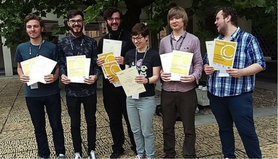 Jake at friends at DrupalCamp Bristol receiving his apprenticeship certificate