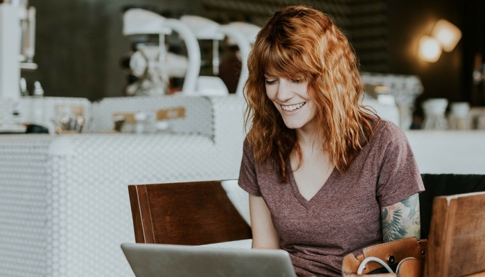 Woman working at a laptop at a desk