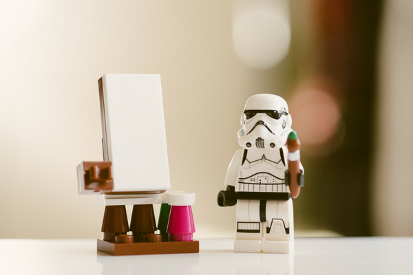 Stormtrooper next to an easel 