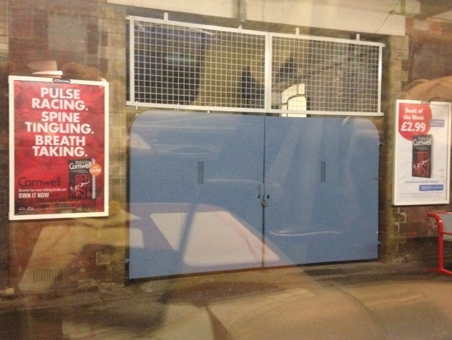 Posters outside Stockport station