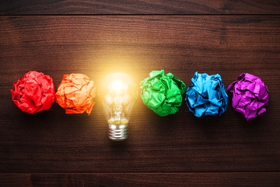 Coloured paper balls with lightbulb replacing yellow