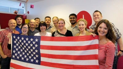Access team holding American Flag