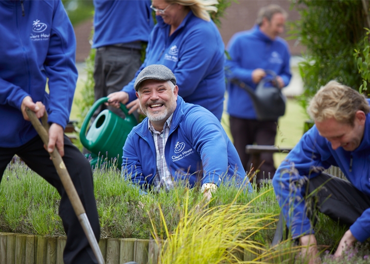 Claire House workers doing gardening